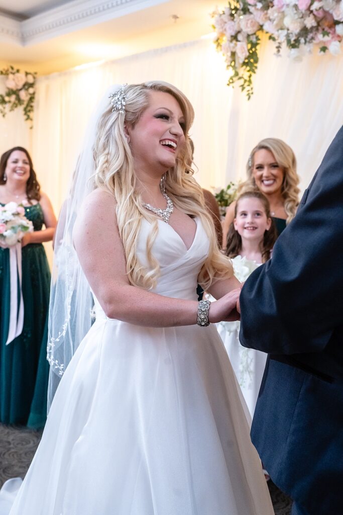 Kristin and Eric exchanging vows at their Fredericksburg wedding photographed by a Virginia wedding photographer