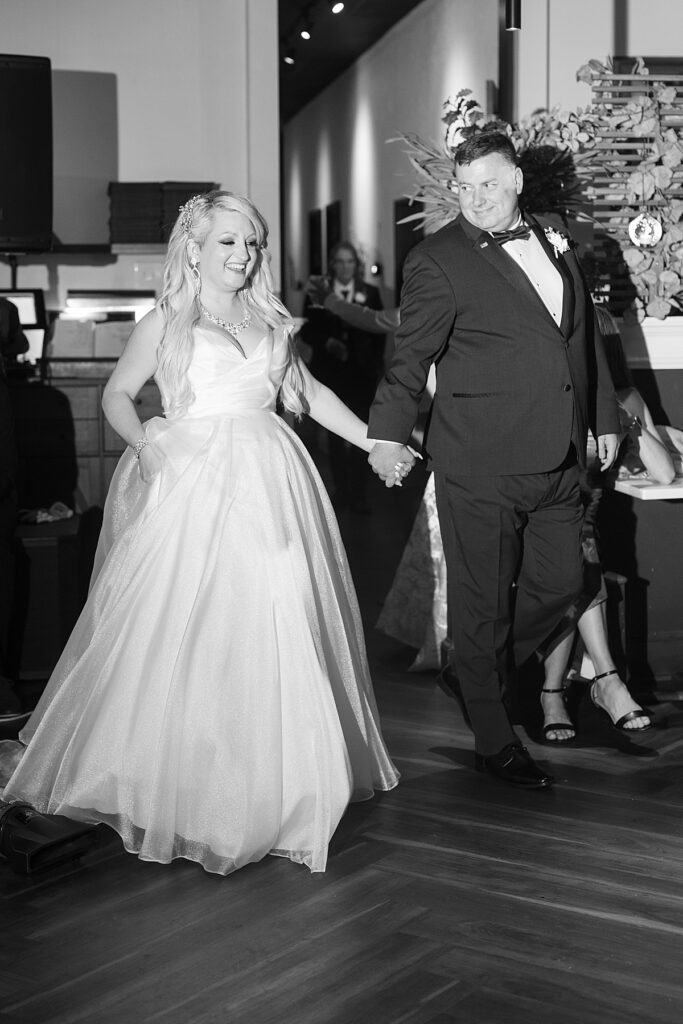 Bride and groom entrance at their wedding reception in Fredericksburg shot by Virginia wedding photographer