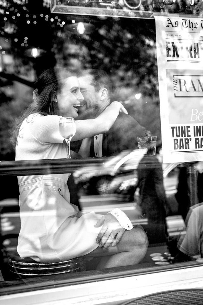 Couple laugh inside Tune Inn bar | Engagement photographer Washington DC