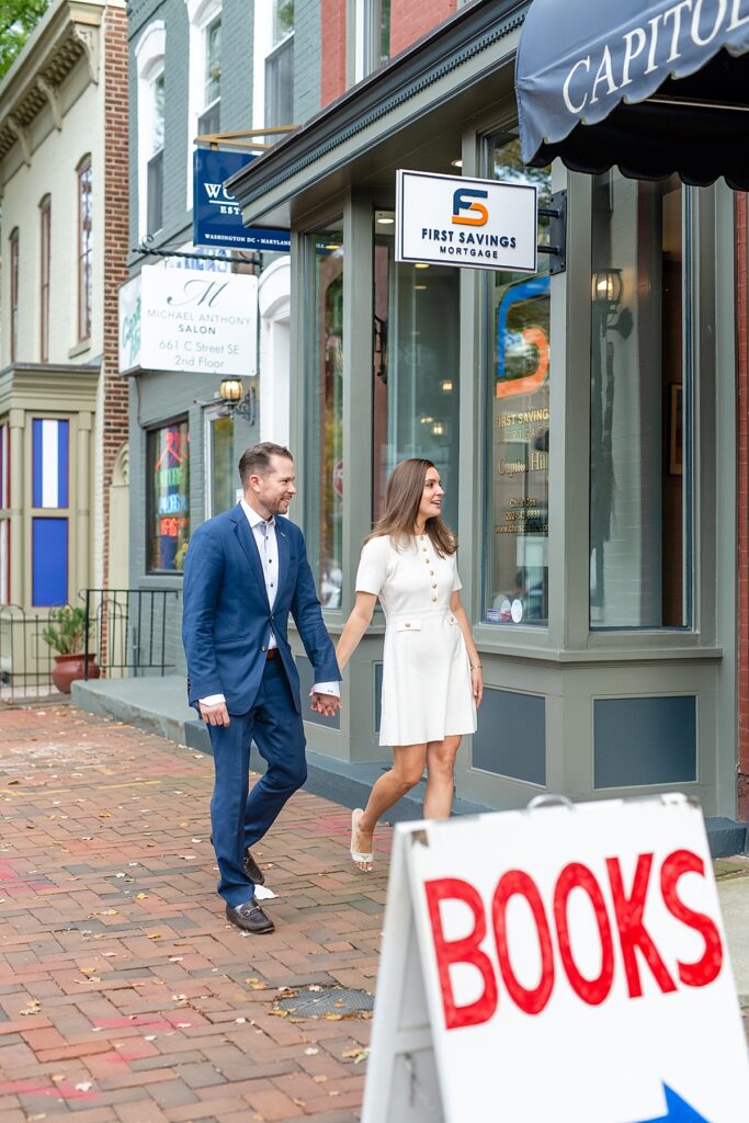 Engaged couple walk by Capitol Hill bookstore | Engagement photographer Washington DC