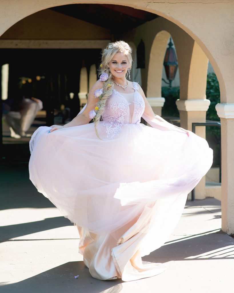 Bride twirls at Orlando wedding style shoot at The Mission Inn