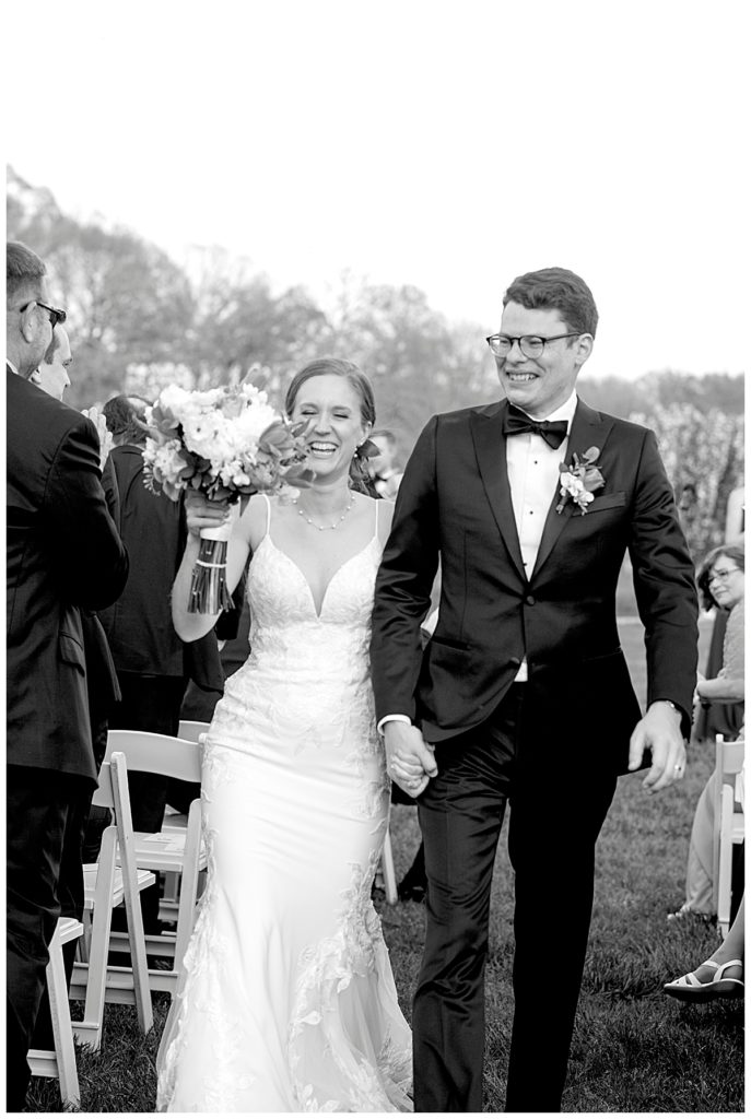 Bride and groom jubilation as they walk down the aisle at the Arboretum in DC.