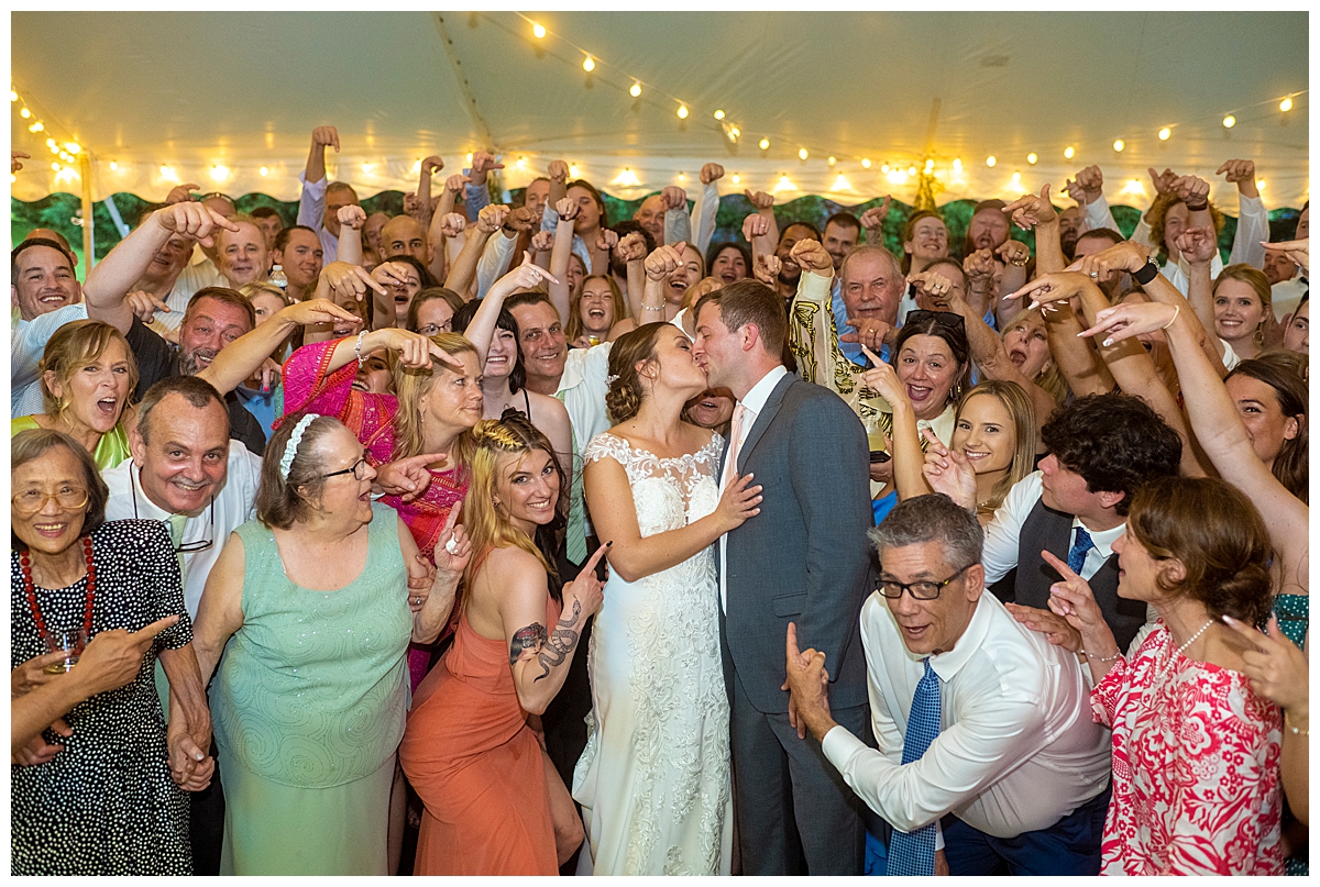 Guests cheer on couple for their at home Maryland wedding.