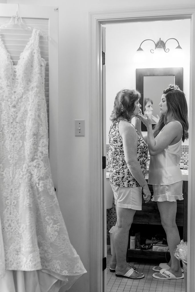 bride helps Mother get ready before Chesapeake Bay wedding at Herrington Inn