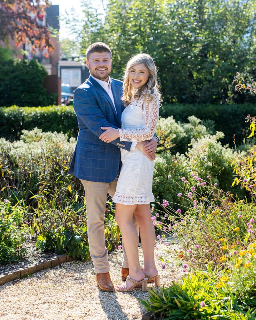 Couple in Paca Garden for engagement photos by Annapolis Wedding Photographer