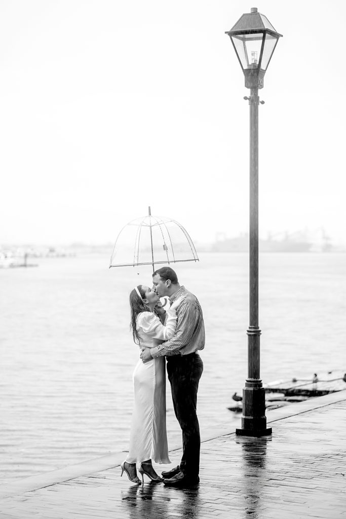 Romantic kiss in the rain - DC engagement photographer
