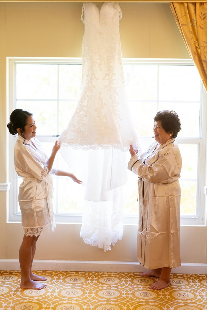 Mother of the bride shares a laugh with her daughter before DC wedding at the Westfields Marriott - Dulles.