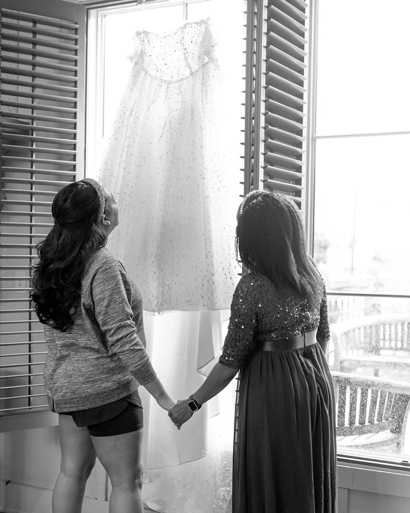 Bride and mother look at dress at The Chesapeake Bay Beach Club, a Washington DC waterfront wedding venue