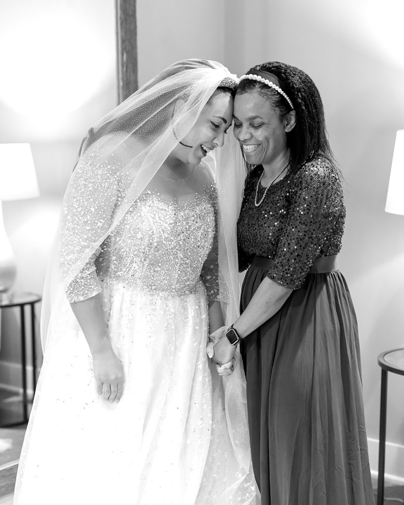 Bride and mother share moment before her wedding