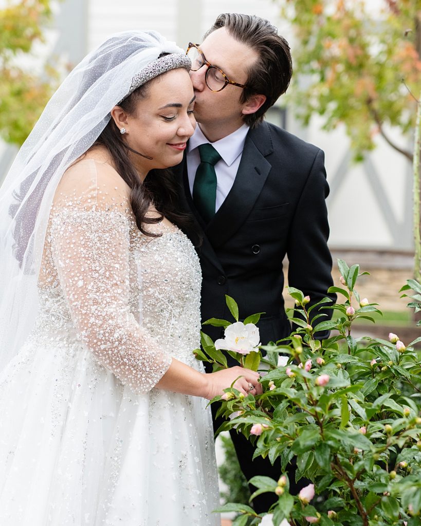 Wedding couple kiss in the garden at The Chesapeake Bay Beach Club