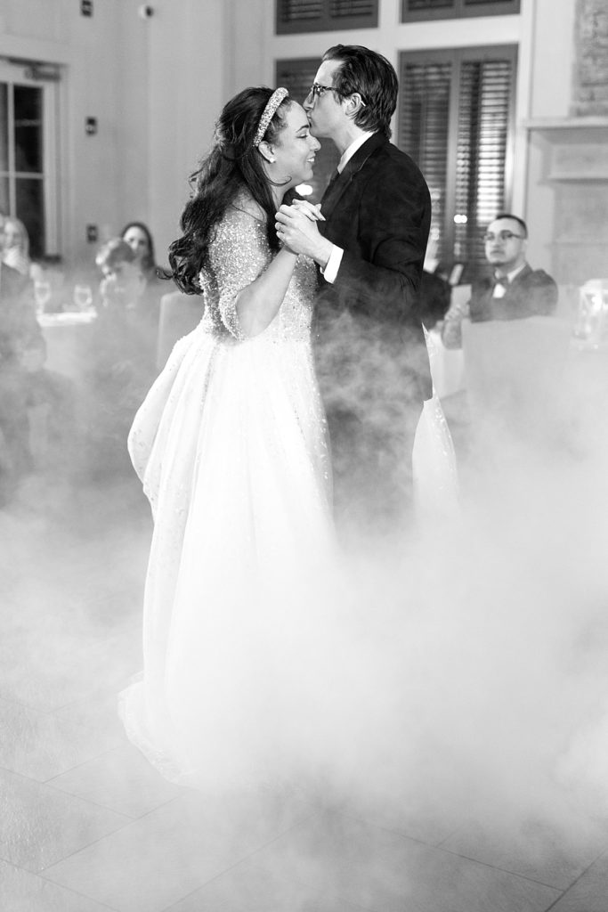 Bride and groom first dance with fog effect