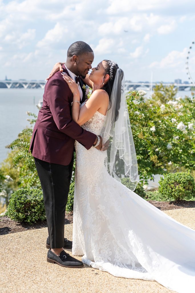 Couple kiss at first look before their Washington National Harbor wedding.