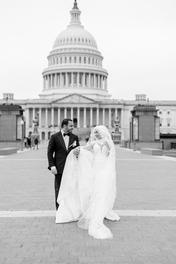 Bride and groom walk outside the US Capitol in Washington DC