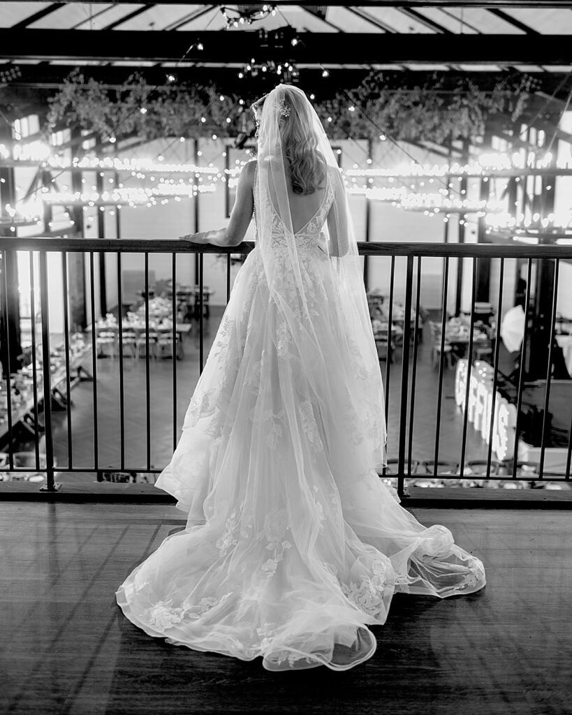 Bride looks down at her wedding reception at kent island resort
