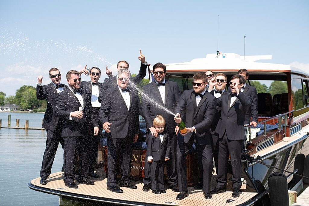 Groomsmen toast groom's wedding at Kent Island Resort