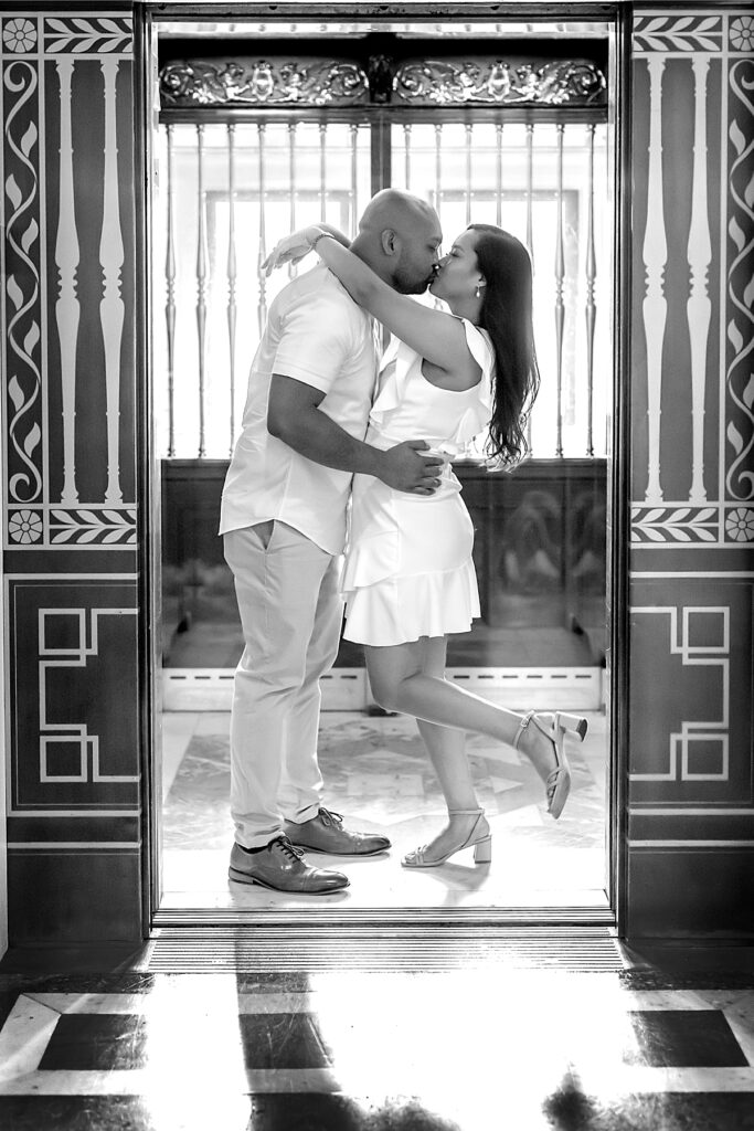 Kiss inside the elevator at the library of congress in dc during indoor engagement photos