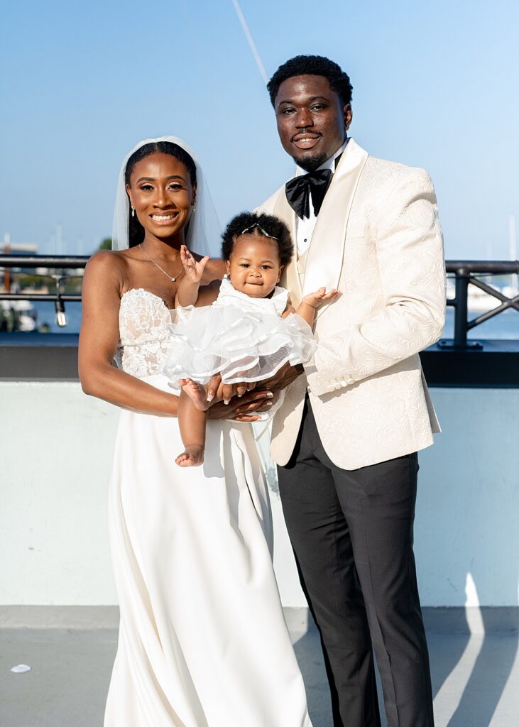 Bride and groom with daughter in Annapolis