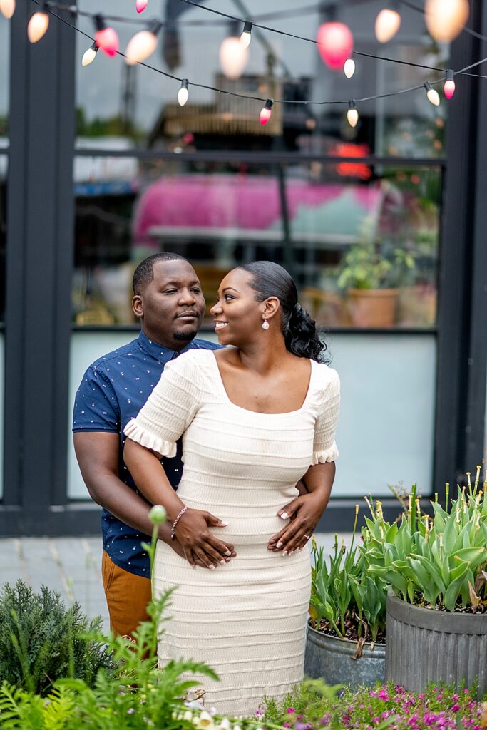 Couple portrait outside the smores camping trailer at The Wharf for Washington DC engagement photos.