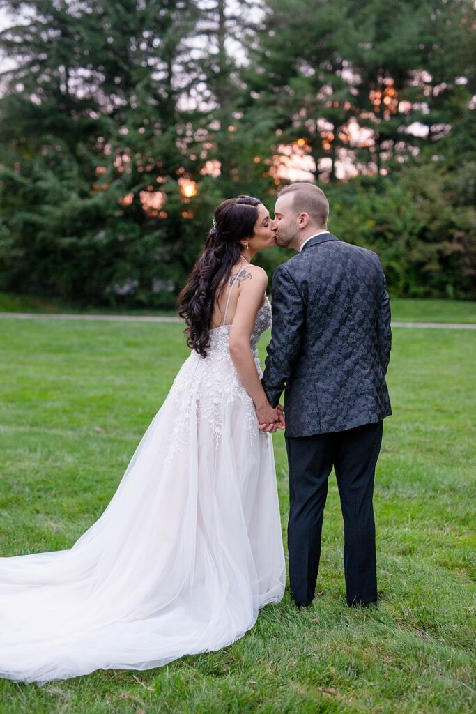 Sunset kiss at their wedding - Grey Rock Mansion