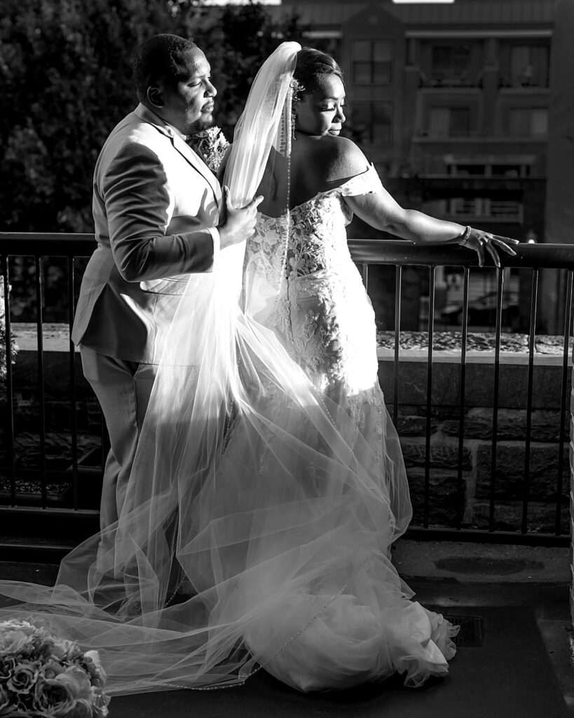 Groom adjusts veil for his bride | Pinstripes Georgetown DC