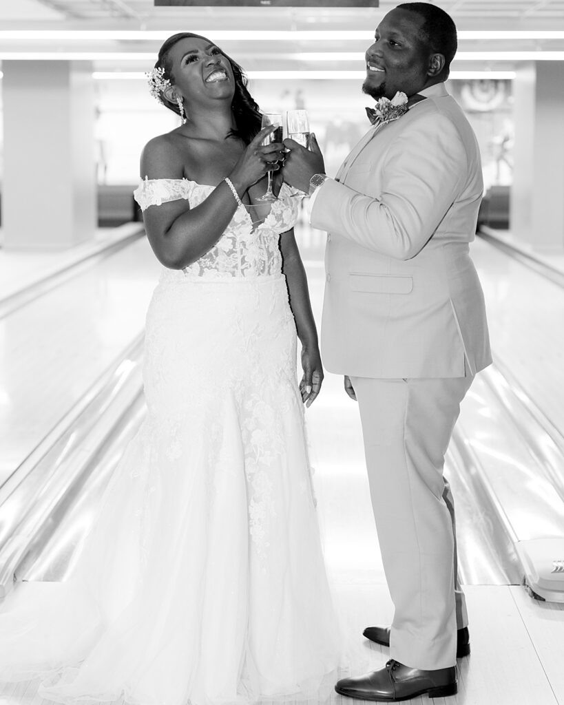 Wedding couple toast in bowling alley of Pinstripes Georgetown DC