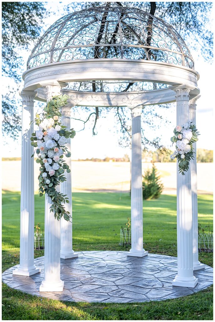 Wedding ceremony gazebo with white florals | Best wedding photographers in Washington, DC