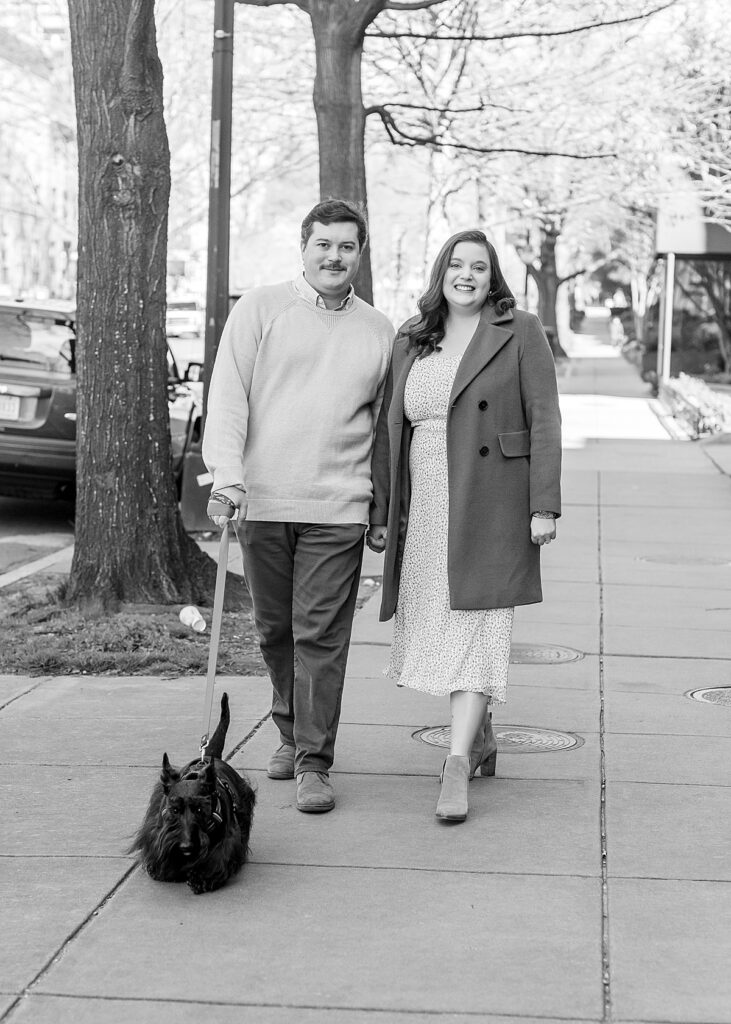 Washington, DC engagement photographer editorial shot of couple walking their dog.
