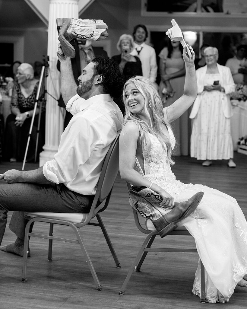 Bride and groom play the shoe game at their wedding reception. 