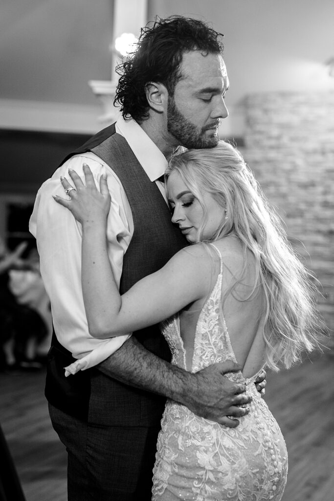 Bride and groom dance at their wedding reception at Kurtz Beach inside the Bay Room