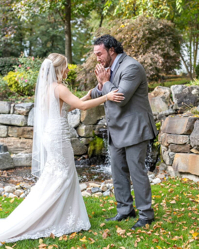 Groom is in tears when he sees his bride for the first time before their ceremony shot by Maryland wedding photographer Nadine Nasby Photography