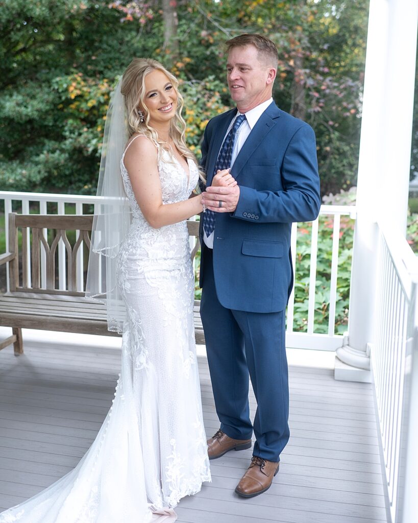 Father of the bride gets the first look of his daughter before ceremony at Kurtz Beach captured by Maryland wedding photographer Nadine Nasby Photography