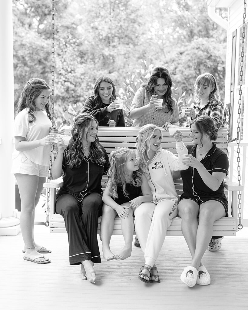 Bride and her bridesmaids toast before ceremony at Kurtz Beach. Photo by Maryland wedding photographer Nadine Nasby Photography.