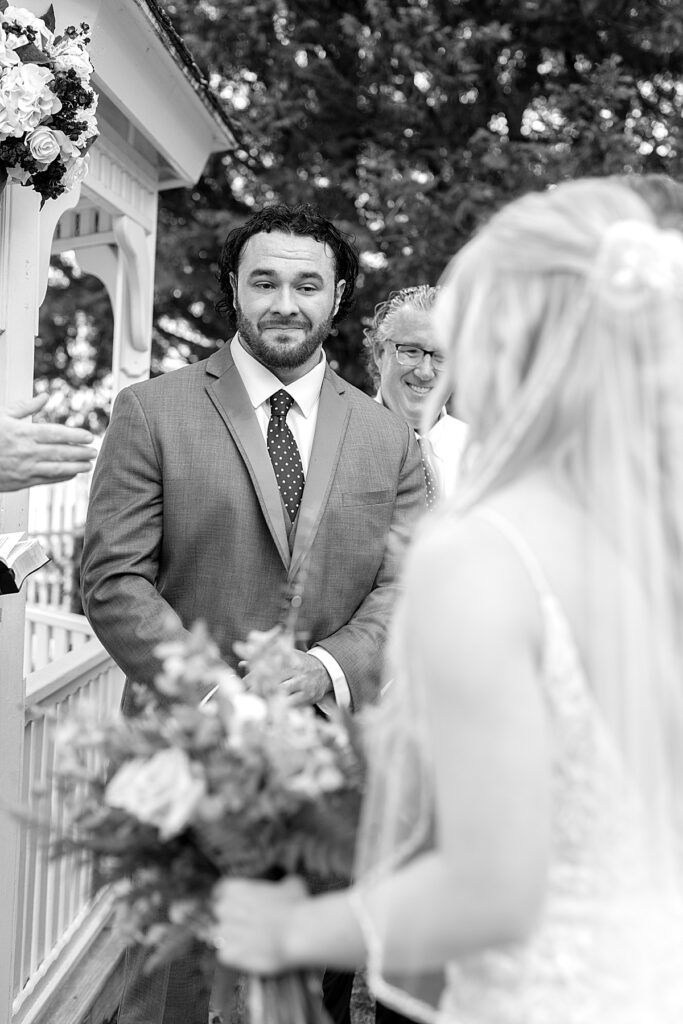 Groom gets emotional seeing his bride at the altat at their wedding at Kurtz Beach Gazebo Hill