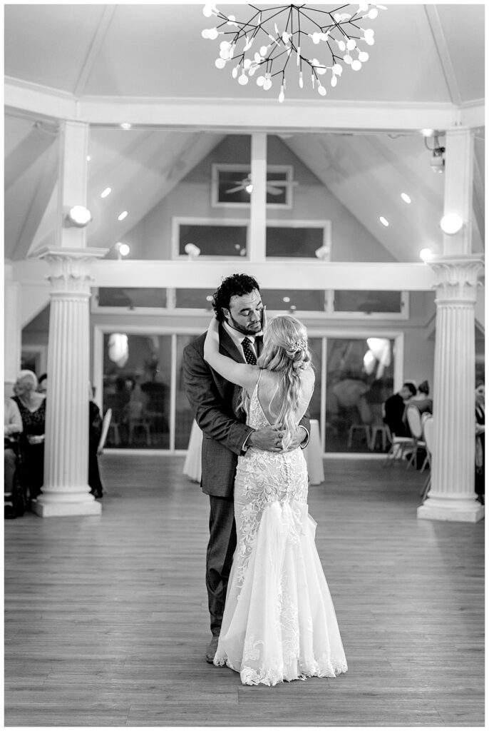 Bride wipes away her husbands tear during their first dance