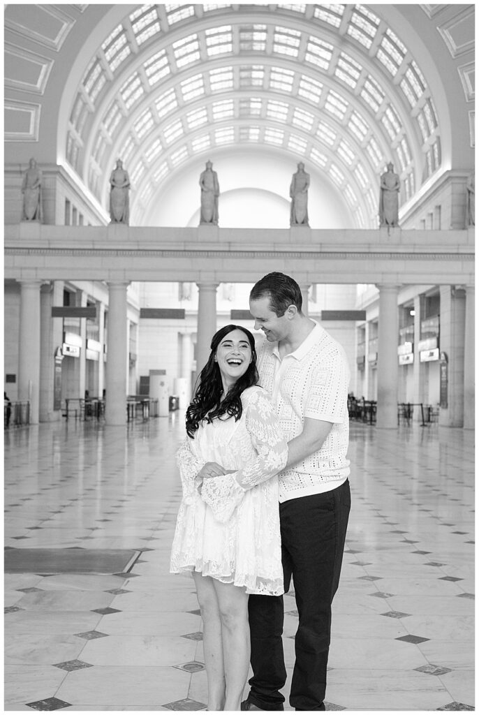 Bride to be laughs with her fiance inside Union Station | Washington DC engagement photographer 