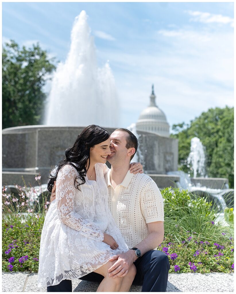 Couple snuggles by fountain in Lower Senate Park near the U.S. Capitol  