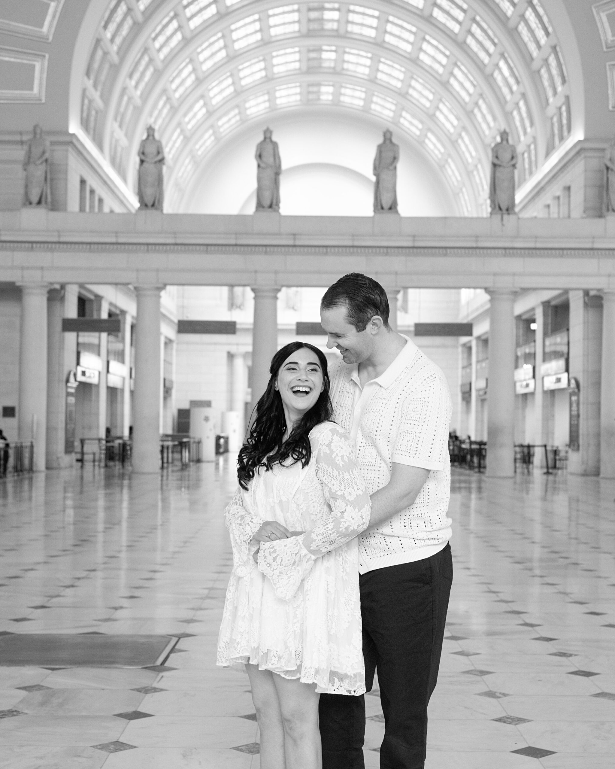 Engaged couple hug inside union station | wedding photographer in Washington DC