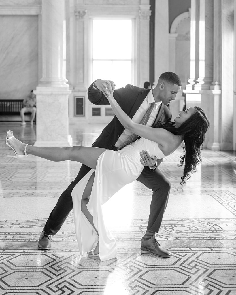 Couple does a dip on the second floor of the Library of Congress