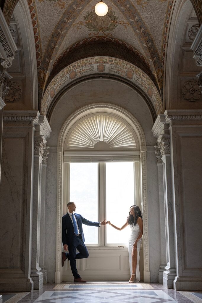 Couple pose by window in the Great Hall of the Library of Congress | Wedding Photos DC