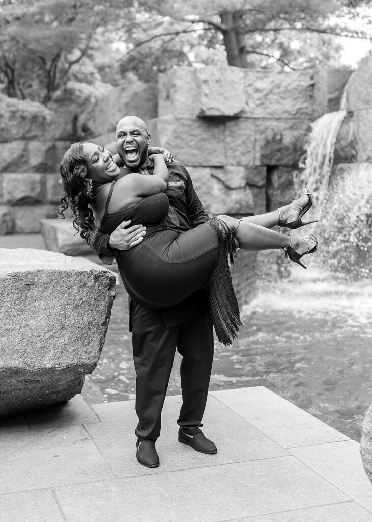 Lifting up for some laughs during their engagement  photo session in DC          