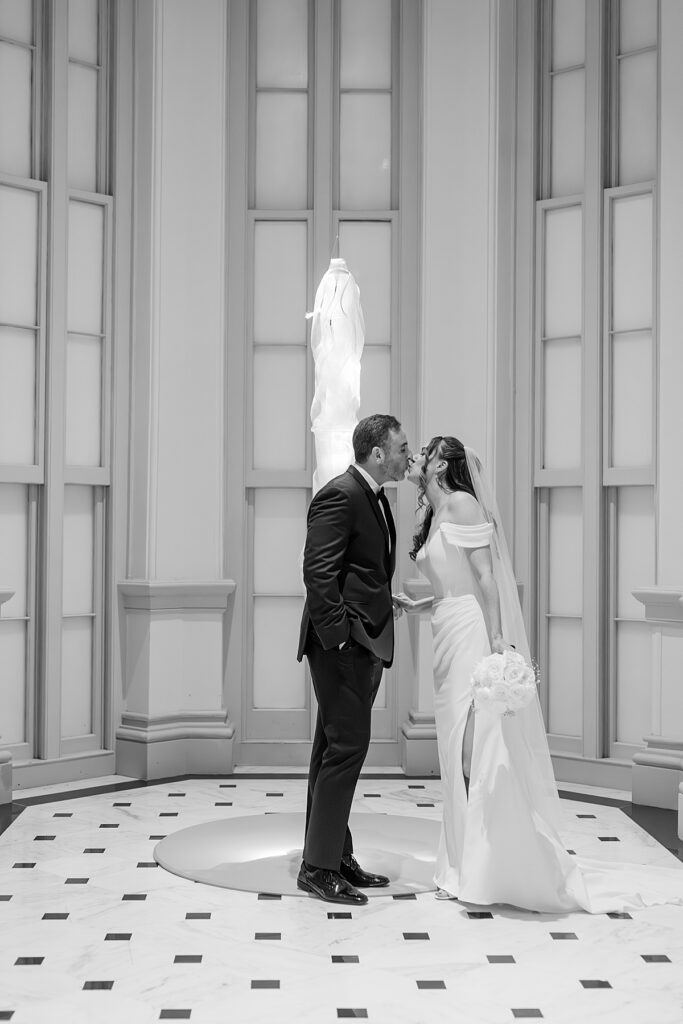 Kiss before nuptials at the Renwick Gallery - fine art wedding photography by Nadine Nasby in DC