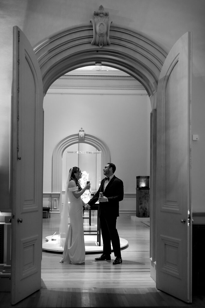 Bride and groom wait for their reception entrance at the Renwick Gallery in DC