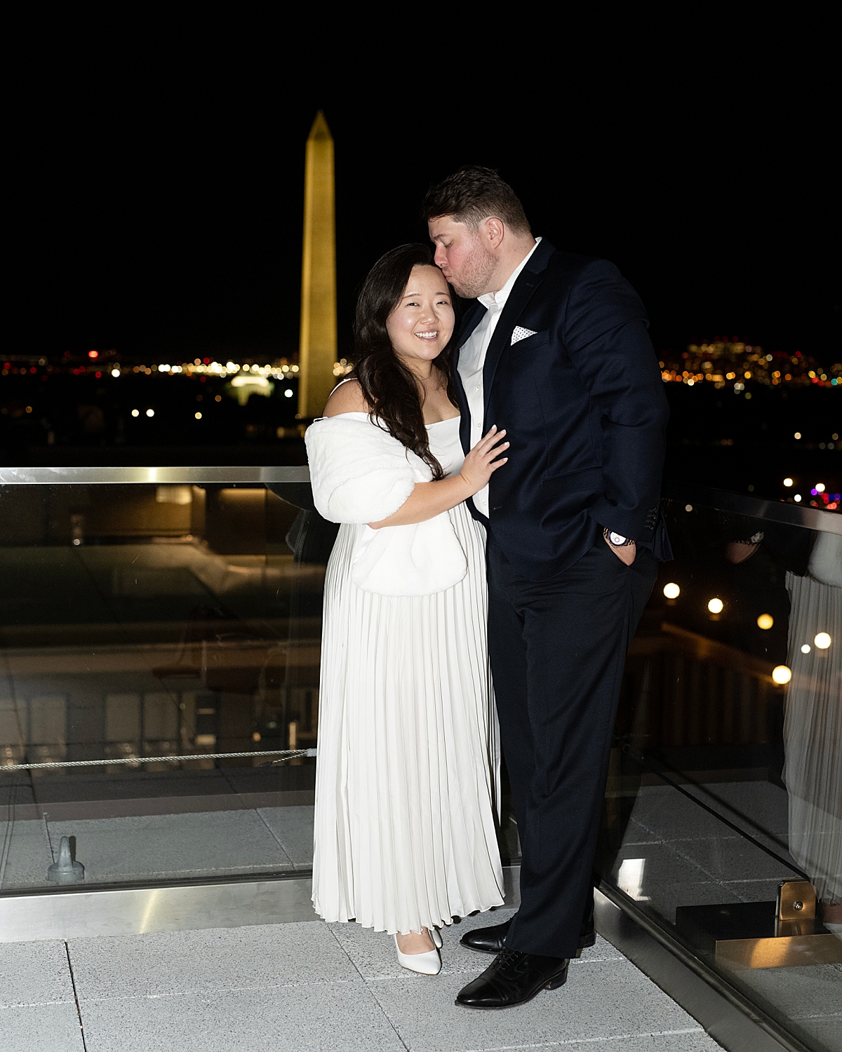 DC photographer portrait of wedding couple on roof of Old Ebbitt Grill at their rehearsal dinner