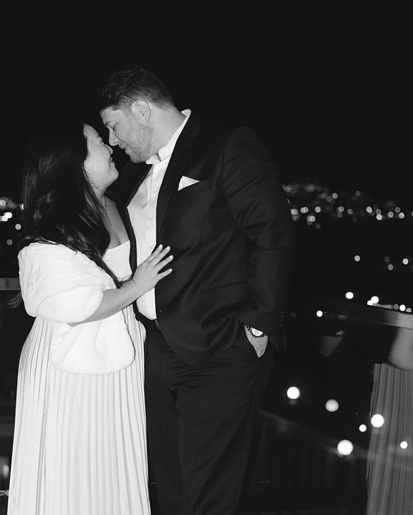 DC photographer portrait of bride & groom at rehearsal dinner on roof of Old Ebbitt Grill