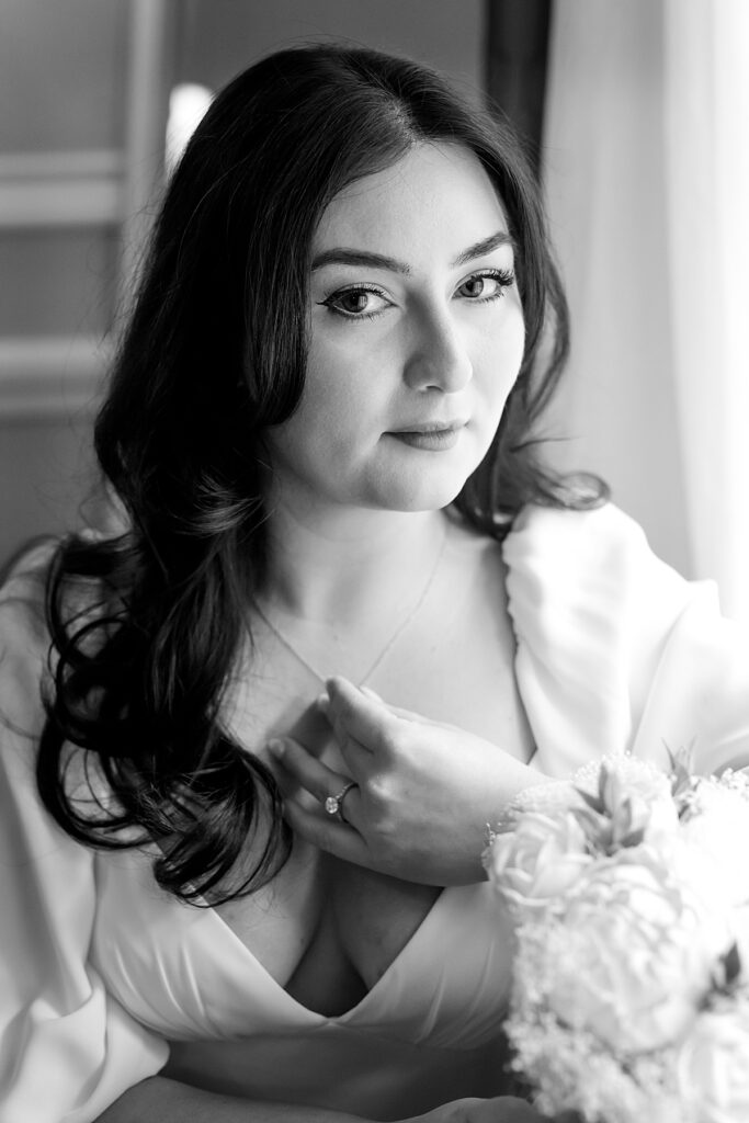 Close-up portrait of bride as she clutches necklace - documentary style wedding photographer DC