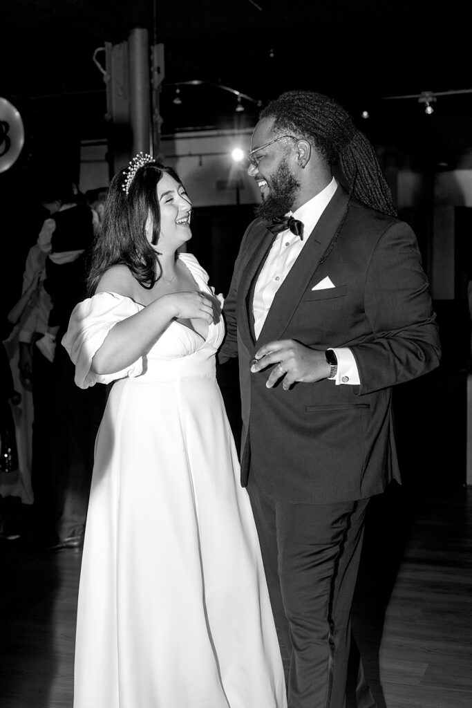 Bride and groom dance at their wedding reception at The Belvedere Co & Events - documentary style wedding photographer DC.