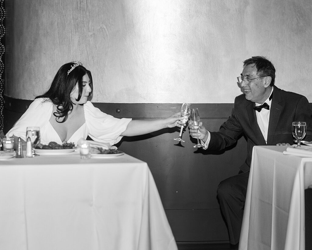 Father of the bride toasts her after his speech at her wedding reception - documentary style wedding photographer DC.