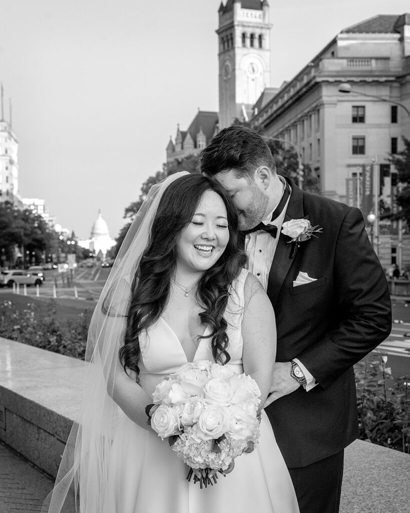 DC wedding photo of bride and groom with US Capitol in the background.